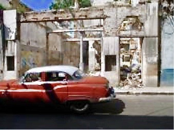 travel-cuba-cars-buildings-justthesizzle